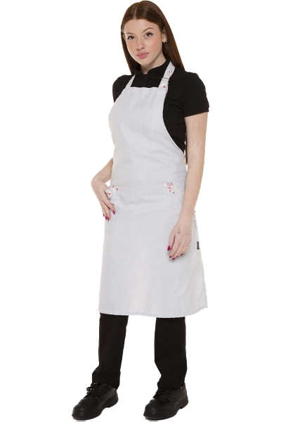grembiule professionale neutro con dettagli floreali indossato da donna