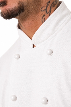 detalle del tejido piqué de la chaqueta de chef blanca